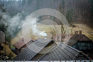 Snow starst falling, smoke starts comming from chimneys