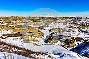 Snow starts to melt in Horseshoe Canyon, Drumheller, Alberta, Canada