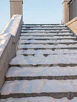 Snow steps, snow-white winter, snow-covered alley steps. Winter background.