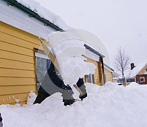 Snow storm, cleaning house, cowered by snow