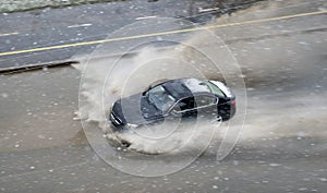 Snow storm in spring and cars