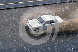 Snow storm in spring and cars