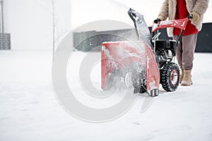 Snow thrower machine in work