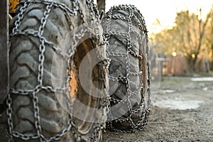 Snow tire chains on big truck wheel