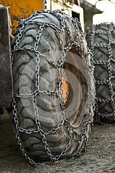 Snow tire chains on big truck wheel