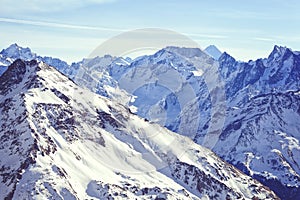 Snow tops of the mountains of the Great Caucasus Range. Ski resort of Elbrus.