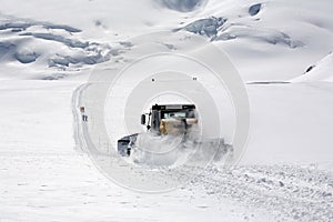 Snow tractor on wintry slope