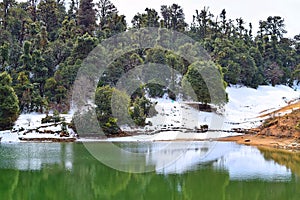 Snow, Trees, and Reflection in Deoria or Deoriya Tal Lake - Beautiful Himalayan Landscape - Uttarakhand, India