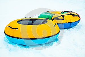 Snow tubing rings close up. hill on background photo