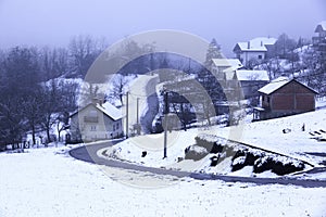 snow in the village, village in the forest.