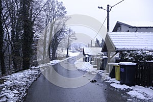 snow in the village, village in the forest.