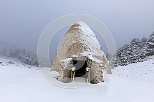 Snow pits in Sierra EspuÃ±a, Region of Murcia, Spain in a snowy landscape photo