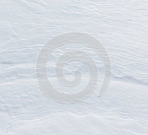 The snow is white and the ground is covered in it