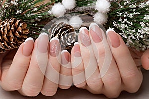 Snow White manicure on female hands. Winter nail design.