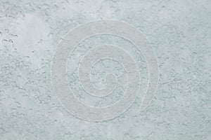 Snow on a window glass, background or texture