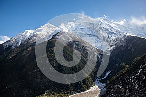 Snow and windy peaks of Annapurna II, Annapurna IV and Annapurna III mountains as seen from Upper Pisang village
