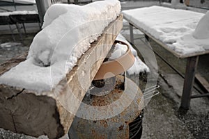 snow on wood and table with corrosive metals