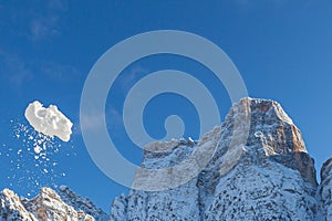 Snowball in flight in front of Mount Pelmo, Dolomites, Italy