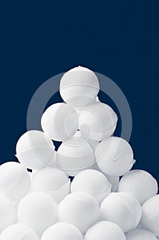 Snowballs heap on dark blue background