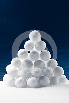 Snowballs heap on dark blue background