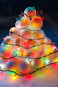 Snowballs heap with festive garland led lights