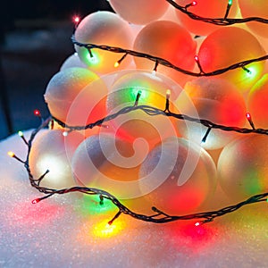 Snowballs heap with festive garland led lights
