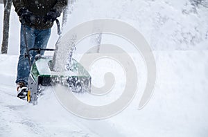 Snowblower in action during a snowstorm in the blizzard