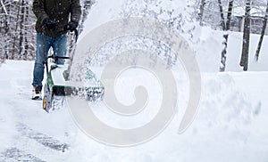 Snowblower in action during a snowstorm in the blizzard