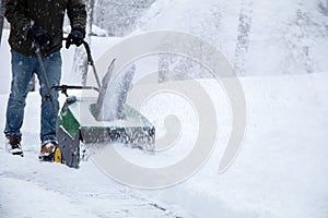 Snowblower in action during a snowstorm in the blizzard