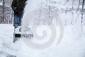 Snowblower in action during a snowstorm in the blizzard