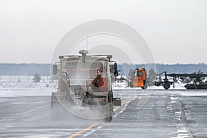 Snowblower cleans airport taxiway in a snowstorm