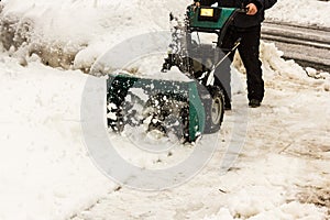 A snowblower in winter, view from the front side