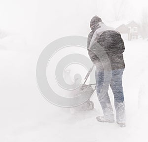 Snowblowing During Blizzard photo