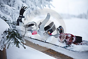 Snowboard with fastening covered with snow photo