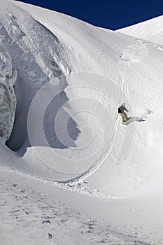 Snowboard freeride in high mountains