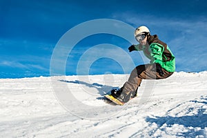 Snowboard freerider in the mountains