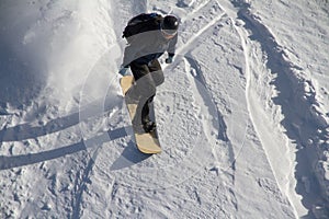 Snowboard freerider in the mountains