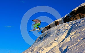 Snowboard jump off a cliff