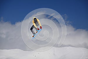 Snowboard rider jumping on mountains. Extreme snowboard freeride sport.