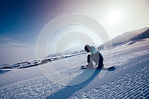 Snowboard snowboarding descent on slope in ski resort