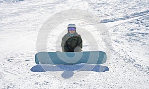 Snowboarder Contemplating on the Slopes