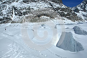 Snowboarder on crevasse field photo