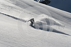 Snowboarder in deep powder snow