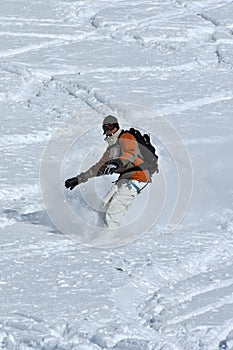 Snowboarder in deep powder snow