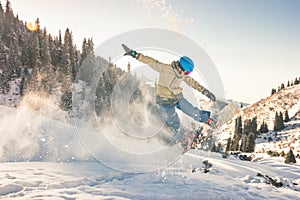 Snowboarder doing his trick method with nose grab