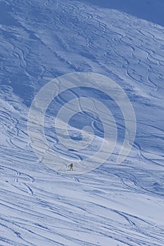 Snowboarder downhill Rothorn at Lenzerheide in the swiss alps