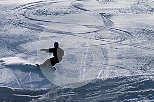 Snowboarder on a downhill run