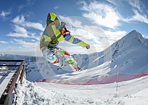 Snowboarder in the free jumping