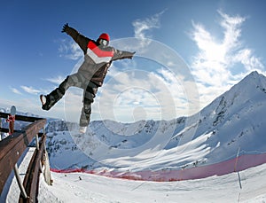 Snowboarder in the free jumping