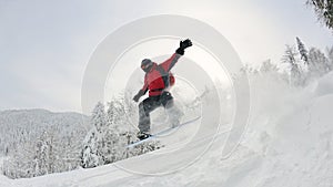 Snowboarder on fresh deep snow